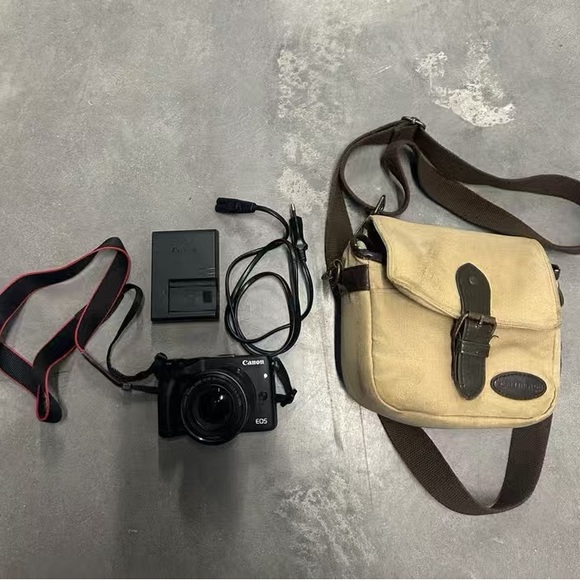 Canon Black EOS Camera with Beige Bag